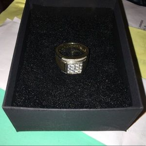 10k gold ring with sterling silver accents going up & around the lab diamonds